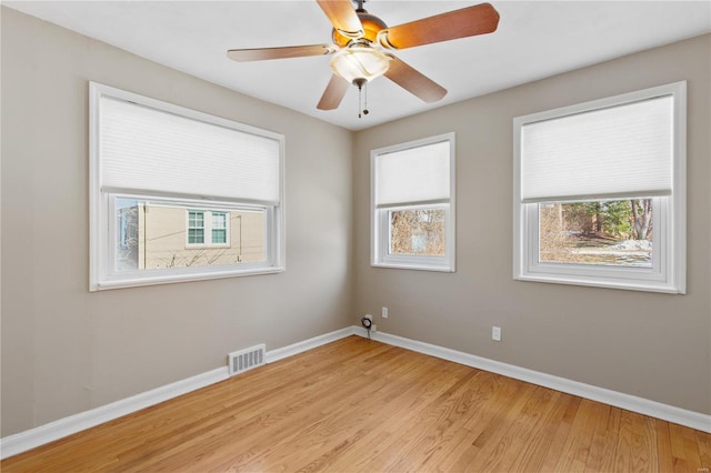 spare room with ceiling fan and light hardwood / wood-style floors