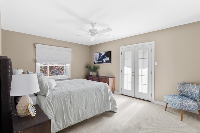 bedroom with light carpet, ceiling fan, and french doors