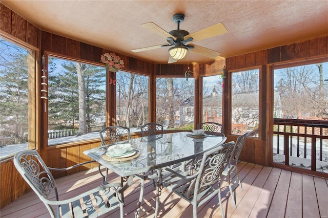 sunroom / solarium featuring ceiling fan