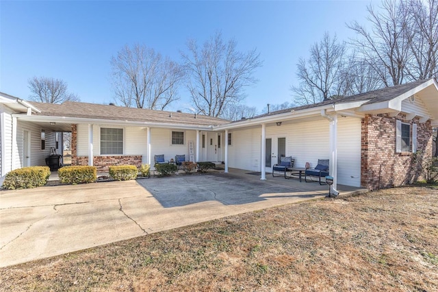 view of front of property featuring covered porch and french doors