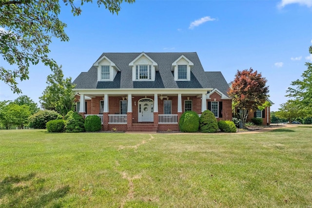 cape cod home with a porch and a front yard