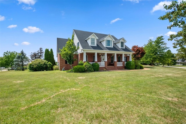 cape cod house featuring a front lawn and a porch