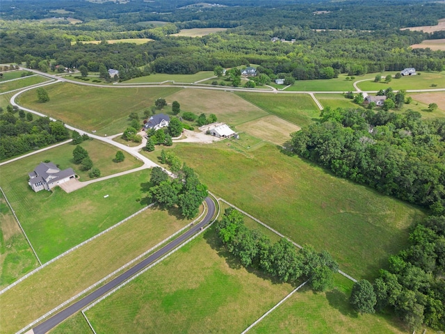 birds eye view of property with a rural view