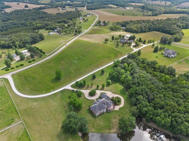 drone / aerial view with a rural view and a water view