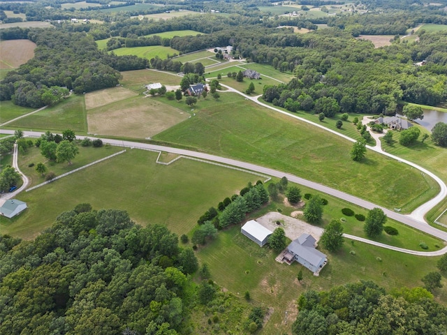 birds eye view of property with a rural view