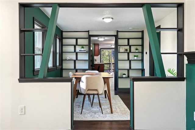 office space with a textured ceiling and hardwood / wood-style floors