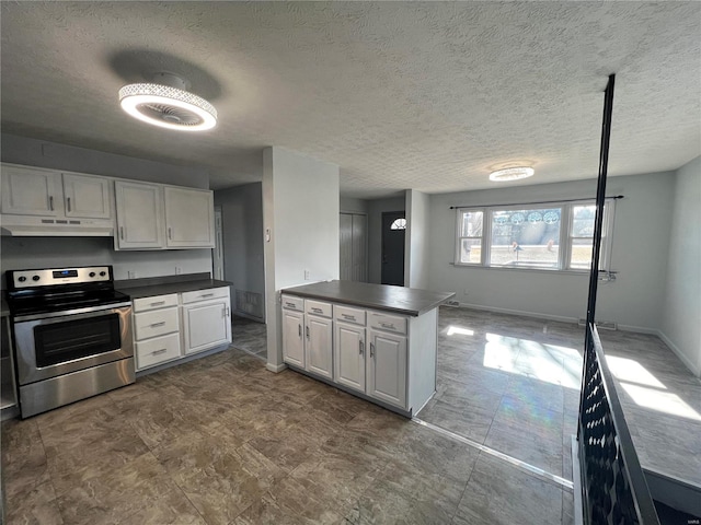 kitchen featuring a textured ceiling, white cabinets, and stainless steel electric range oven