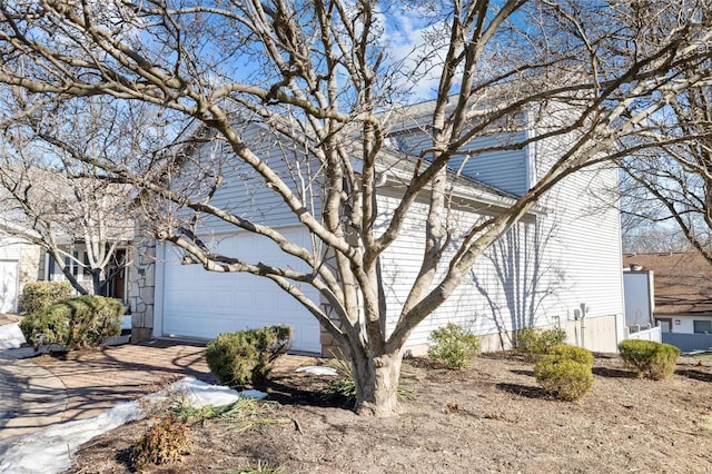 view of property exterior with a garage