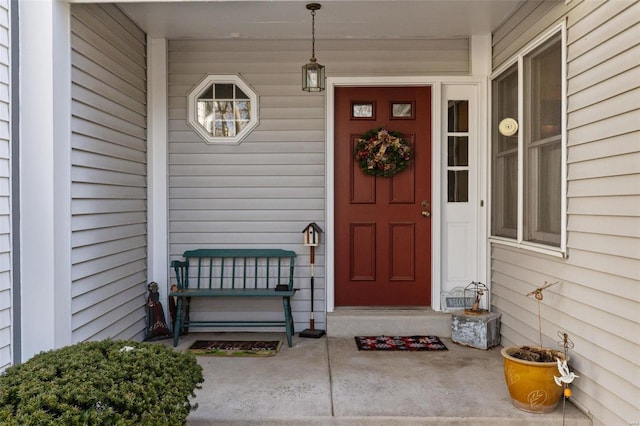 view of exterior entry featuring a porch