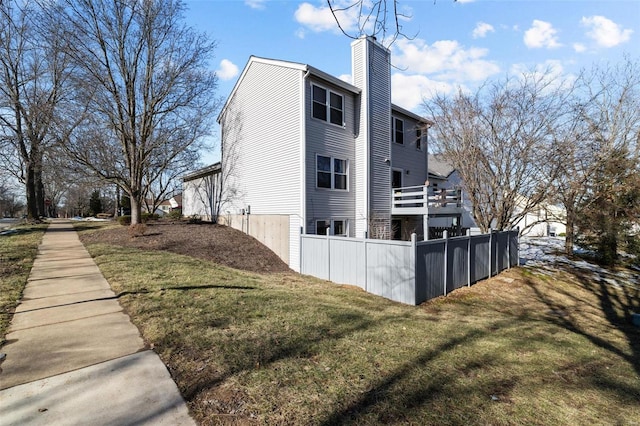 view of property exterior with a lawn