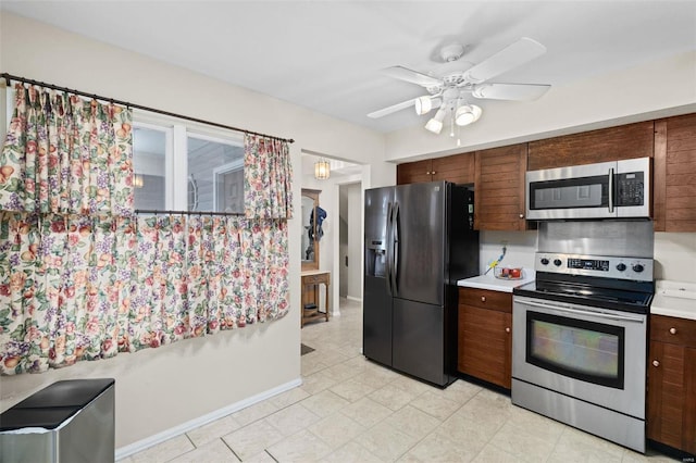 kitchen featuring stainless steel appliances and ceiling fan