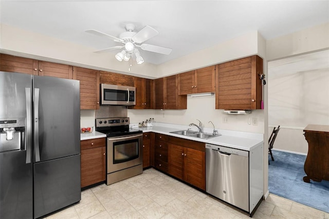 kitchen with sink, stainless steel appliances, and ceiling fan