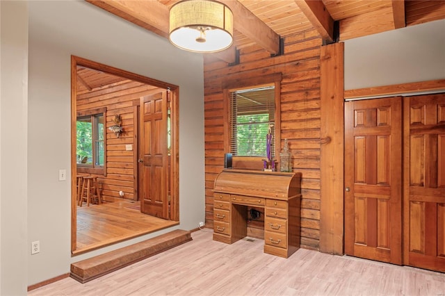 office area with wood ceiling, a wealth of natural light, log walls, and beamed ceiling