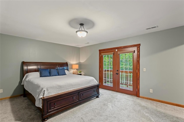 carpeted bedroom with access to exterior and french doors