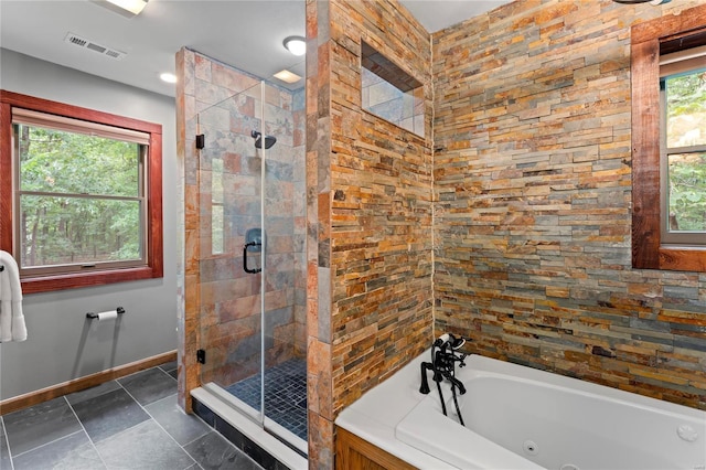 bathroom with separate shower and tub