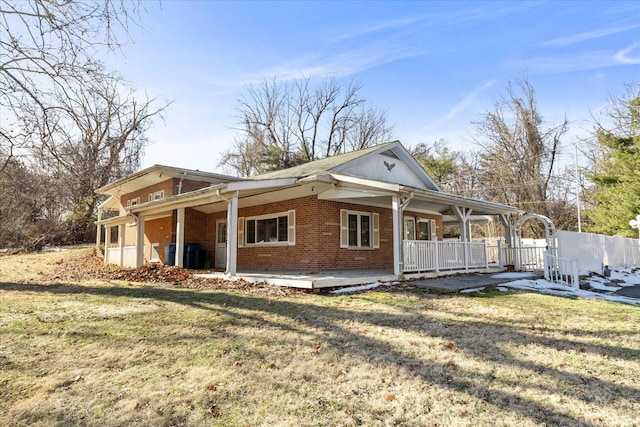 view of side of home featuring a lawn