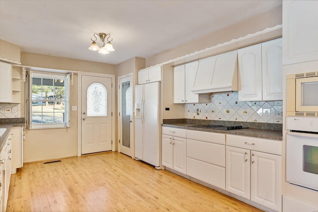 kitchen featuring white cabinetry, white appliances, custom range hood, and light hardwood / wood-style flooring