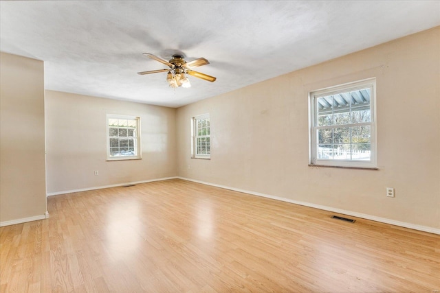 unfurnished room featuring light hardwood / wood-style flooring and ceiling fan