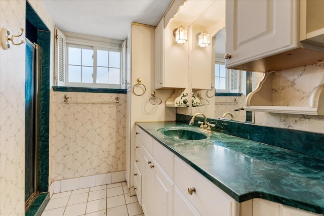 bathroom with tile patterned flooring and vanity