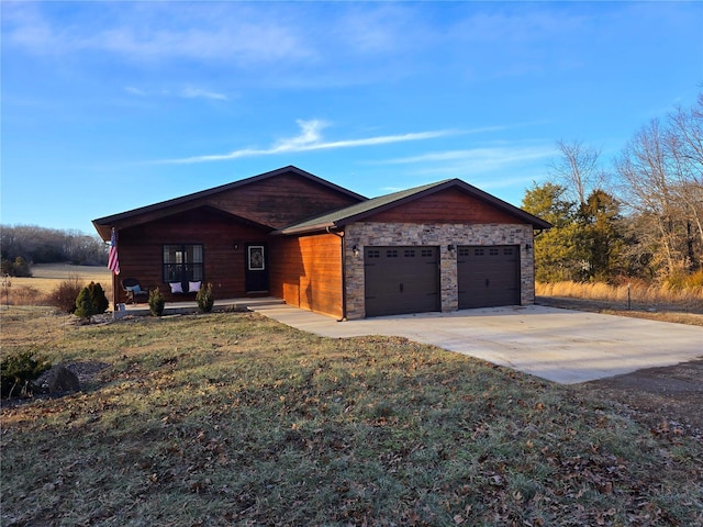 view of front of property with a garage and a front yard