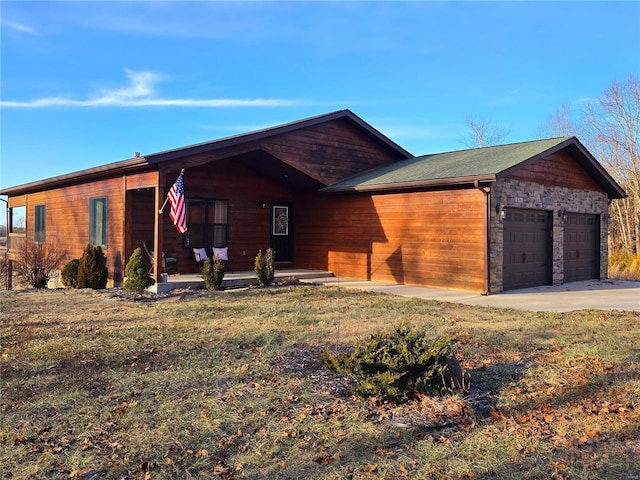 ranch-style home with a garage, covered porch, and a front yard