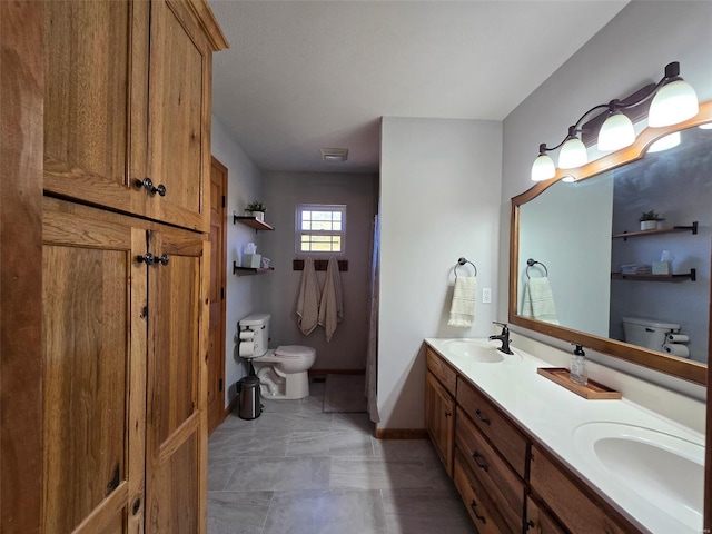 bathroom with vanity and toilet