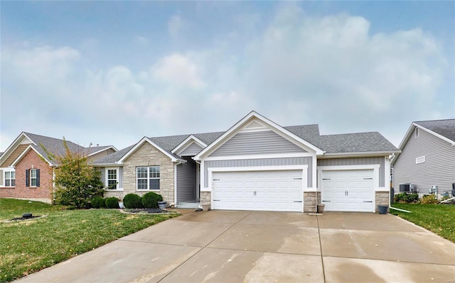 view of front of home featuring a garage and a front yard