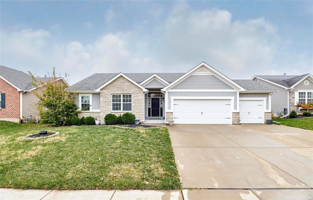 view of front of house featuring a front yard and a garage