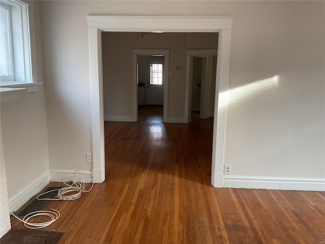 hall with dark wood-type flooring