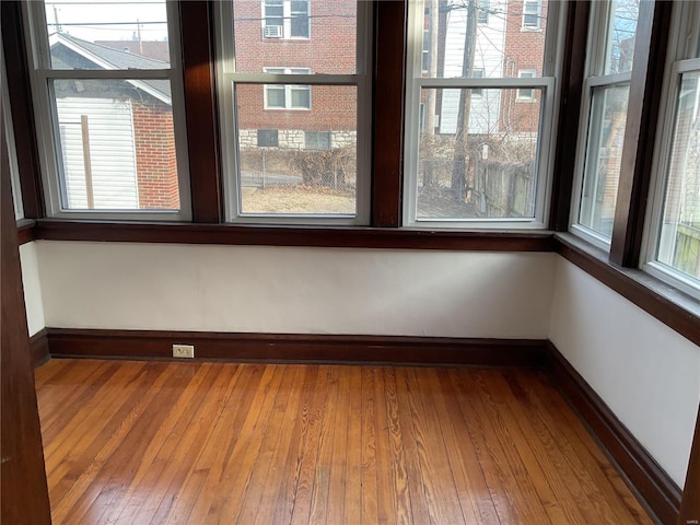 spare room with hardwood / wood-style floors