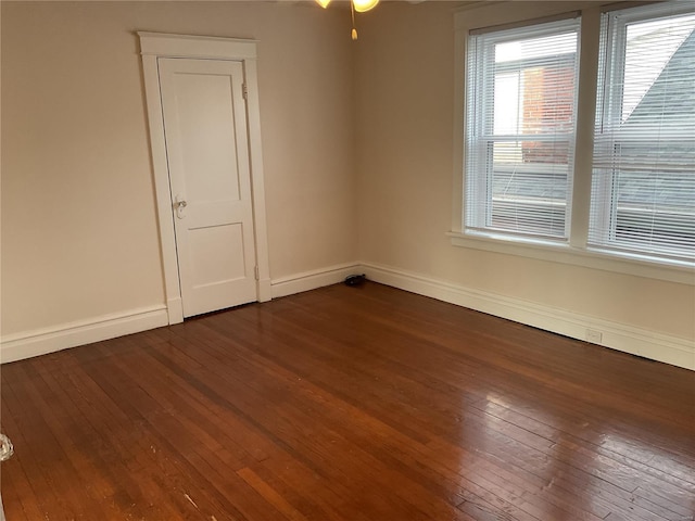 unfurnished room featuring dark hardwood / wood-style flooring