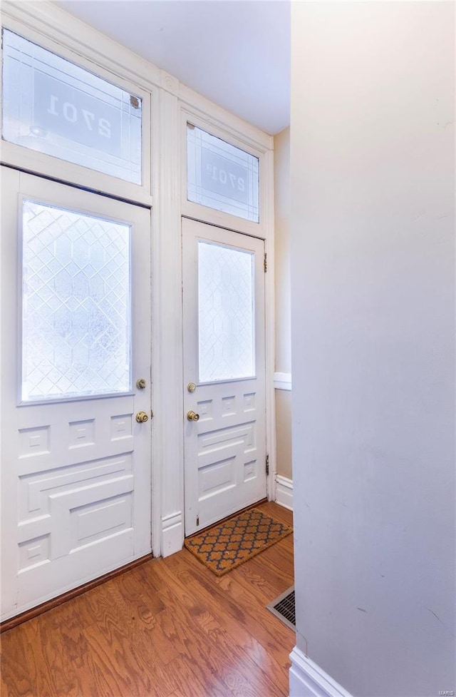 entryway with light hardwood / wood-style floors