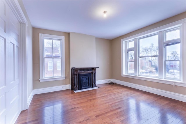 unfurnished living room with hardwood / wood-style floors