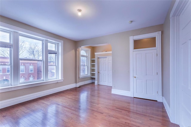 unfurnished bedroom featuring a closet and light hardwood / wood-style flooring