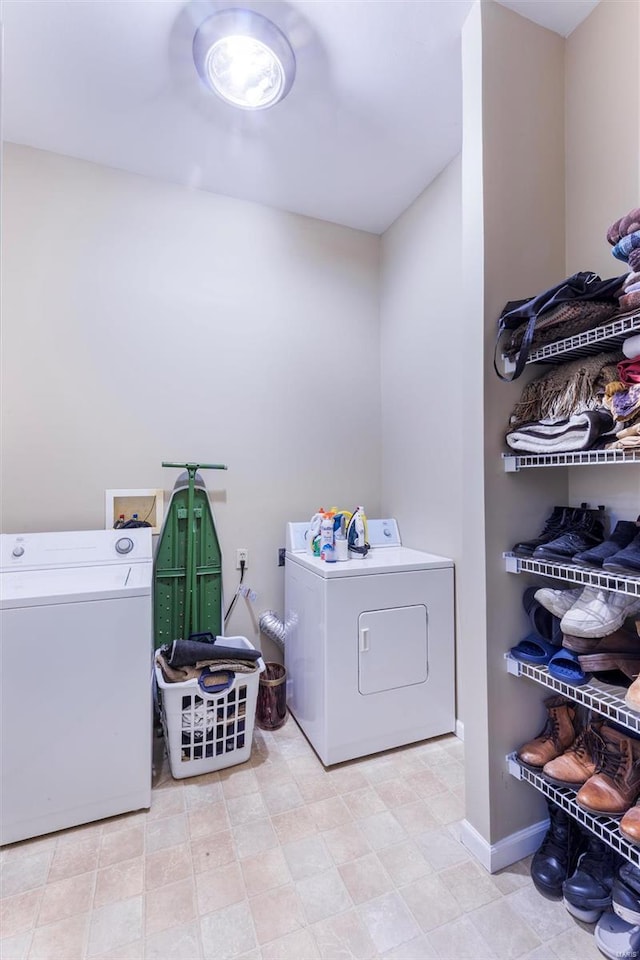 clothes washing area with washer and dryer