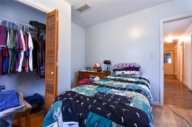 bedroom featuring a closet and hardwood / wood-style flooring