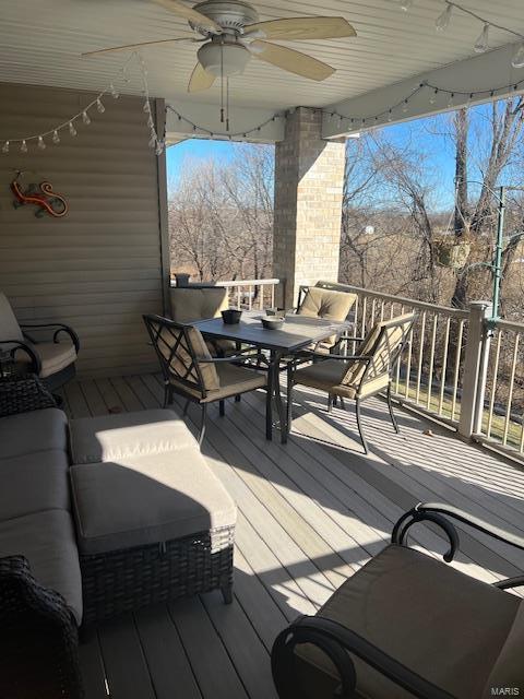 deck with ceiling fan and outdoor lounge area