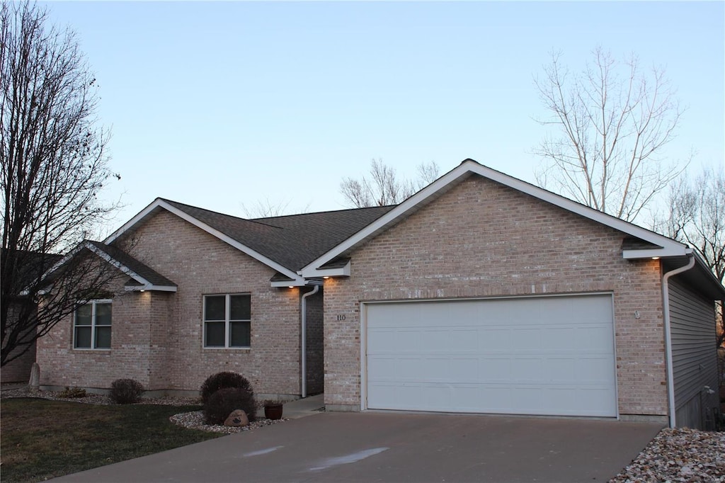 single story home featuring a garage