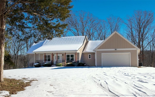 view of front of house with covered porch and a garage