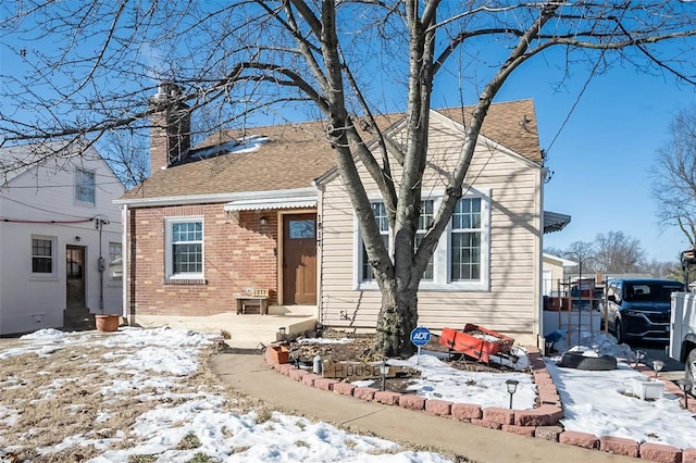 view of snow covered house