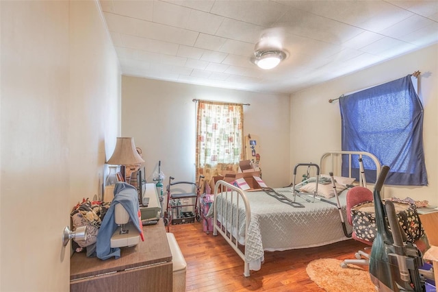 bedroom featuring hardwood / wood-style floors