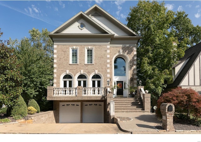 neoclassical home with a garage