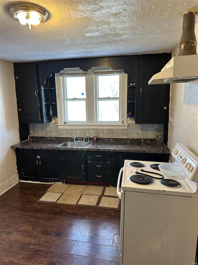 kitchen featuring a textured ceiling, white electric range, dark hardwood / wood-style floors, and sink