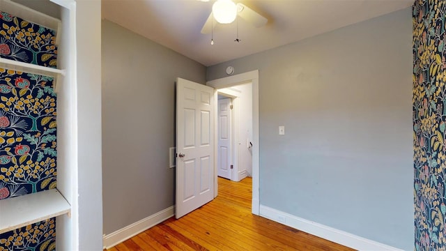 bedroom featuring hardwood / wood-style flooring and ceiling fan