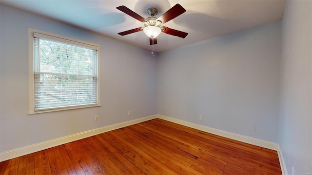 spare room featuring ceiling fan and wood-type flooring