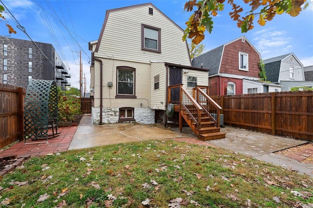 back of house with a patio area