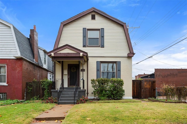 view of front of home featuring a front lawn