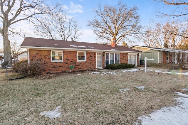 ranch-style house featuring a yard