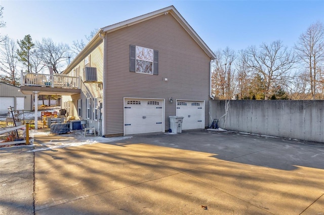 view of side of home with a garage