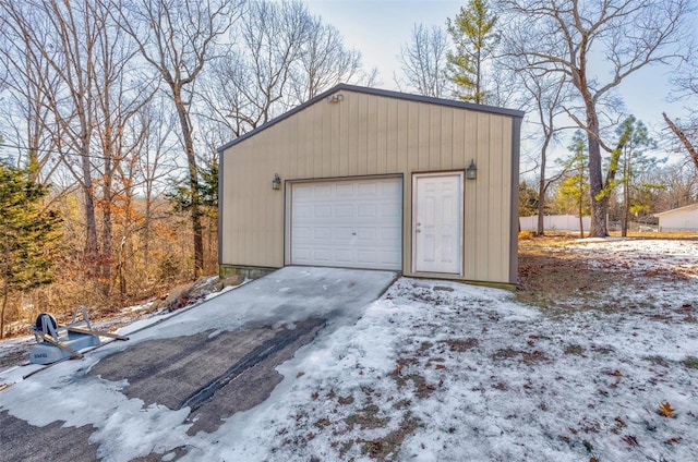 view of snow covered garage